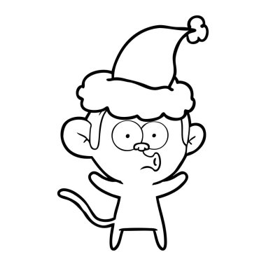 Noel Baba şapkası giyen bir sürpriz maymun çizgi çizme