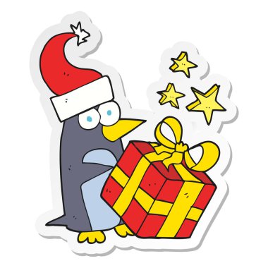 etiket bir karikatür hediye olan Noel penguen