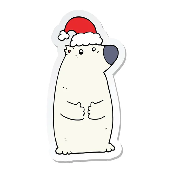 Aufkleber eines Cartoon-Bären mit Weihnachtsmütze — Stockvektor