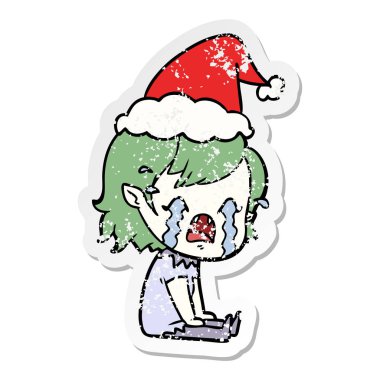 Noel Baba şapkası giyen ağlayan bir vampir kız sıkıntılı etiket karikatür el çekilmiş