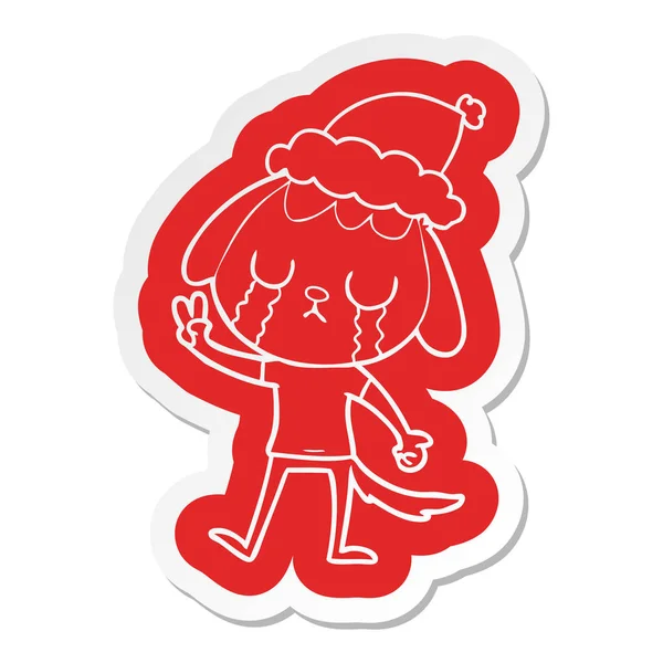 可爱的古怪的卡通贴纸的狗哭穿着圣诞老人的帽子 — 图库矢量图片