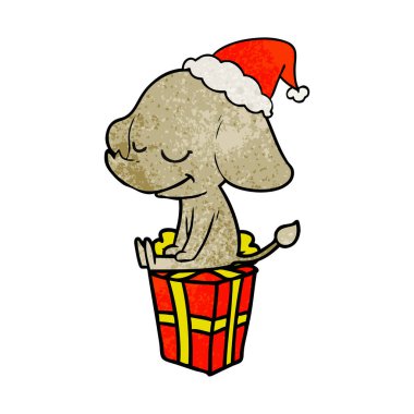 Noel Baba şapkası giyen gülümseyen bir filin dokulu çizgi film el çekilmiş