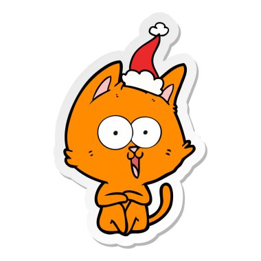Komik el çekilmiş etiket karikatür Noel Baba şapkası giyen bir kedi
