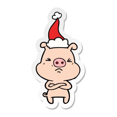 etiket karikatür kızgın domuz Noel Baba şapkası giyen bir el çekilmiş