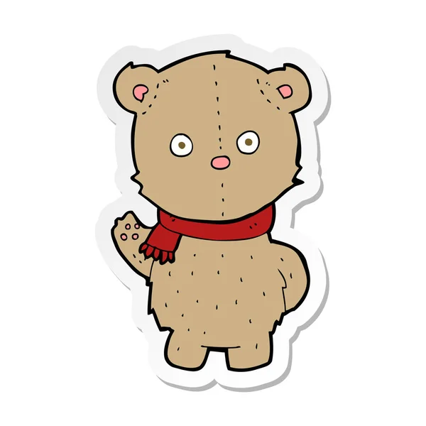 Autocollant d'un ours en peluche dessin animé portant une écharpe — Image vectorielle