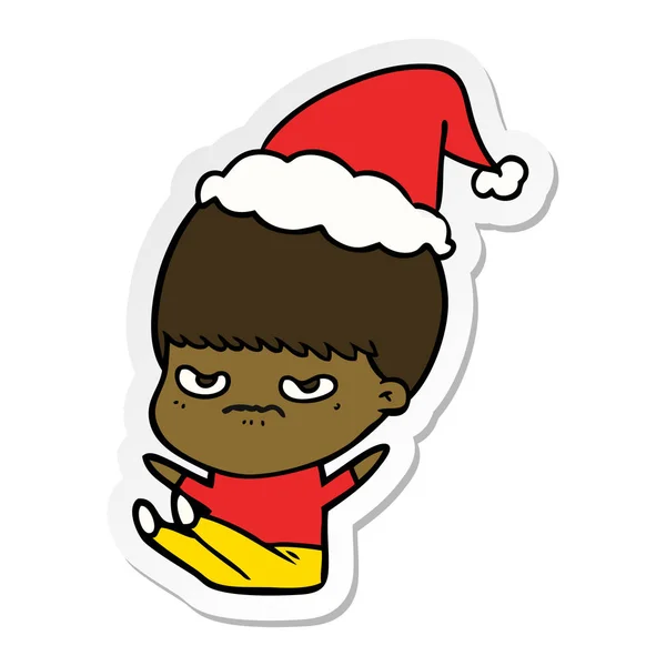 Desenho animado adesivo de um menino usando chapéu de Papai Noel —  Vetores de Stock