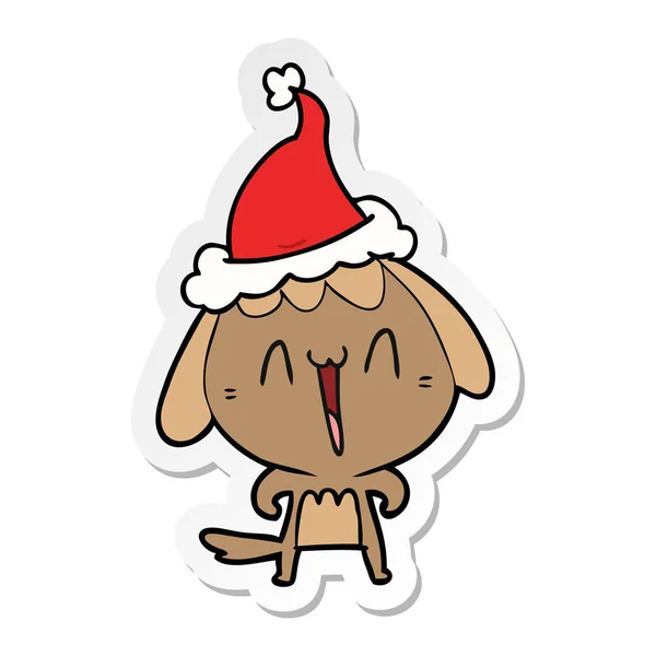 Niedlichen Aufkleber Karikatur eines Hundes mit Weihnachtsmütze — Stockvektor