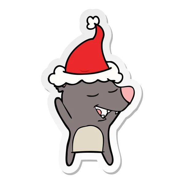 Aufkleber Karikatur eines Bären mit Weihnachtsmütze — Stockvektor