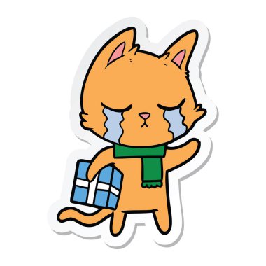 etiket Noel hediyesi tutan ağlayan bir karikatür kedi