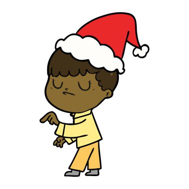 Noel Baba şapkası giyen bir huysuz çocuğun çizgi çizme