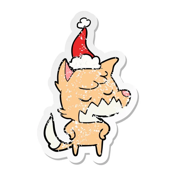 Autocollant sympathique en détresse dessin animé d'un renard portant un chapeau de Père Noël — Image vectorielle