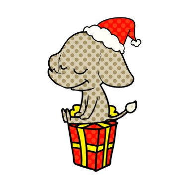 çizgi roman tarzı resimde gülümseyen bir filin Noel Baba şapkası giyen el çekilmiş