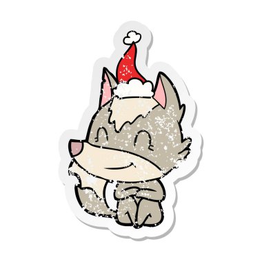 sıkıntılı etiket karikatür Noel Baba şapkası giyen bir kurt dostu el çekilmiş