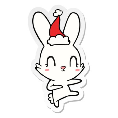 etiket karikatür giyen Noel Baba şapkası dans bir tavşan sevimli el çekilmiş