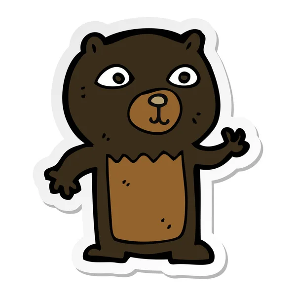 一个卡通挥舞黑熊幼崽的贴纸 — 图库矢量图片