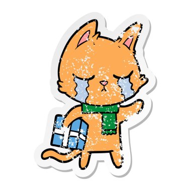 Noel hediyesi tutan ağlayan bir karikatür kedi sıkıntılı etiket