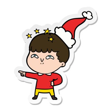 etiket karikatür Noel Baba şapkası giyen bir hayran çocuğun el çekilmiş
