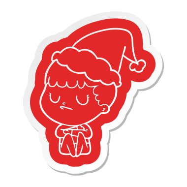 Noel Baba şapkası giyen bir huysuz çocuğun ilginç çizgi film etiketi