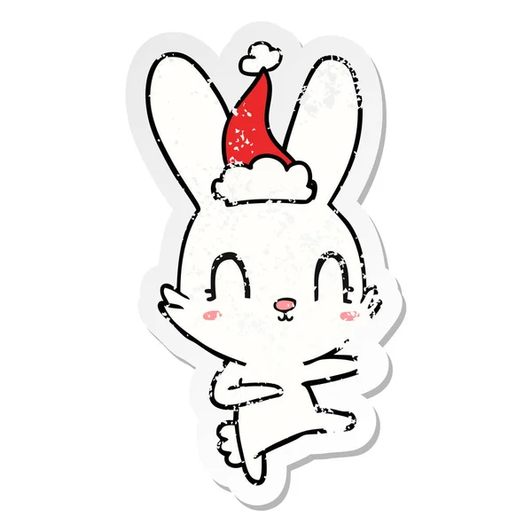 Cute Hand Drawn Distressed Sticker Cartoon Rabbit Dancing Wearing Santa — Stock Vector