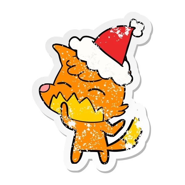 Autocollant affligé dessin animé d'un renard portant un chapeau de Père Noël — Image vectorielle