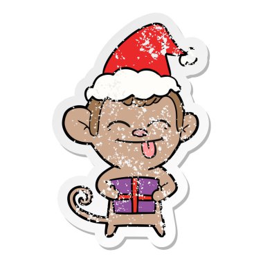 bir maymunun Noel hediyesi giyen Noel Baba şapkası ile etiket karikatür komik elle çizilmiş sıkıntılı