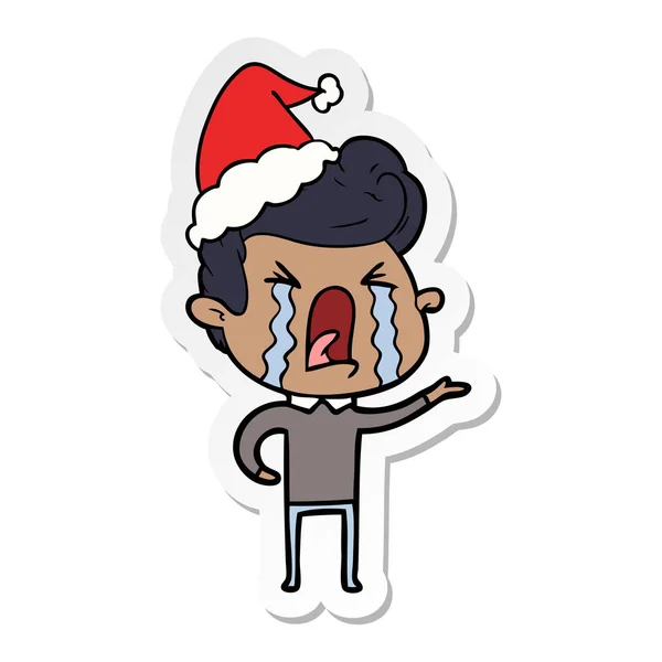 Sticker cartoon of a crying man wearing santa hat — Stock Vector