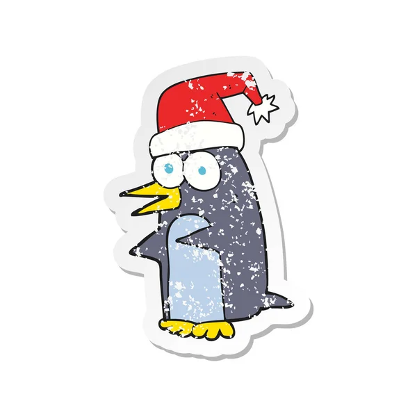 Autocollant en détresse rétro d'un pingouin de Noël dessin animé — Image vectorielle