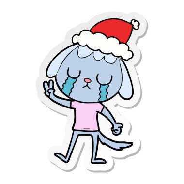 etiket karikatür giyen Noel Baba şapkası ağlıyor bir köpek sevimli el çekilmiş