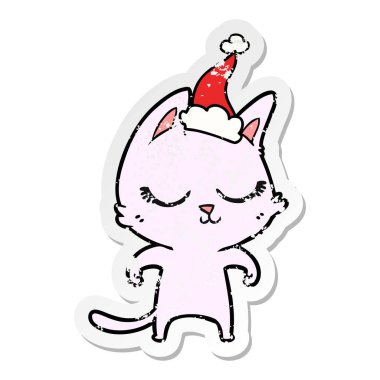 Sakin elle çizilmiş etiket karikatür Noel Baba şapkası giyen bir kedi sıkıntılı