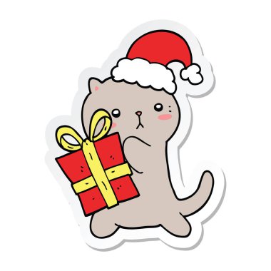 etiket Noel hediyesi taşıyan bir sevimli çizgi kedi