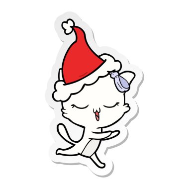 bir kedinin kafasına Noel Baba şapkası giyen yay ile etiket çizgi film