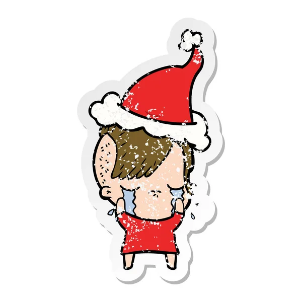Distressed sticker cartoon of a crying girl wearing santa hat — Stock Vector
