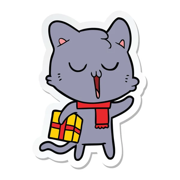 Adesivo di un gatto dei cartoni animati con regalo — Vettoriale Stock