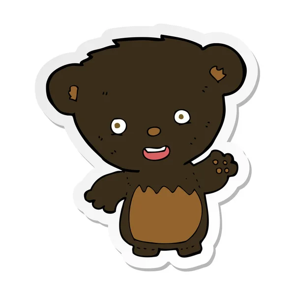 Sticker of a cartoon black bearcub waving — Stock Vector