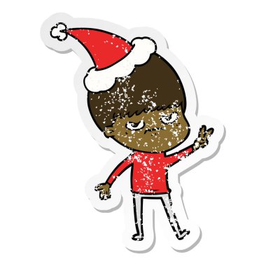 sıkıntılı etiket karikatür Noel Baba şapkası giyen bir çocuk rahatsız el çekilmiş