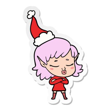 oldukça çizilmiş etiket karikatür Noel Baba şapkası giyen bir elf kızın el
