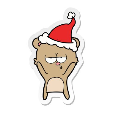 sıkılmış ayı etiket karikatür giyen Noel Baba şapkası