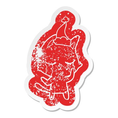 Noel Baba şapkası giyen bir kedinin ilginç karikatür sıkıntılı etiket ağlıyor