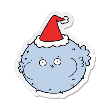 etiket karikatür Noel Baba şapkası giyen bir kirpi balığı balık el çekilmiş