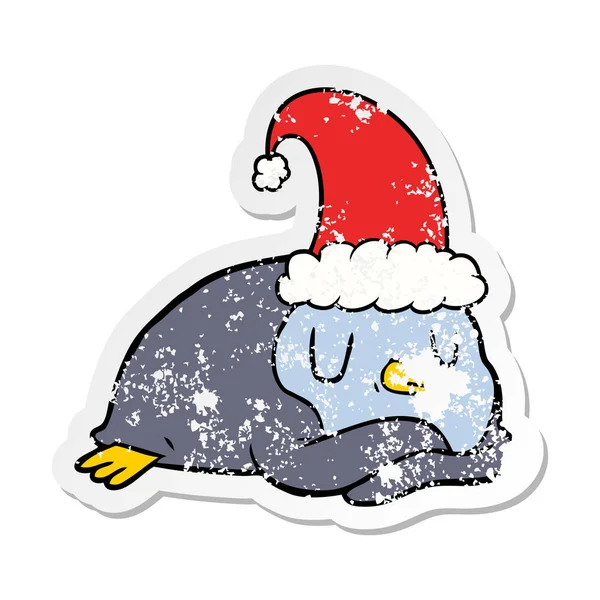 Etiqueta angustiada de um pinguim de desenho animado usando chapéu de Natal —  Vetores de Stock