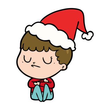 Noel Baba şapkası giyen bir huysuz çocuğun çizgi çizme