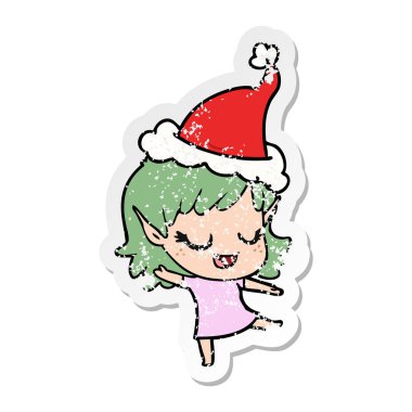 Noel Baba şapkası giyen bir elf kızın sıkıntılı etiket karikatür mutlu el çekilmiş