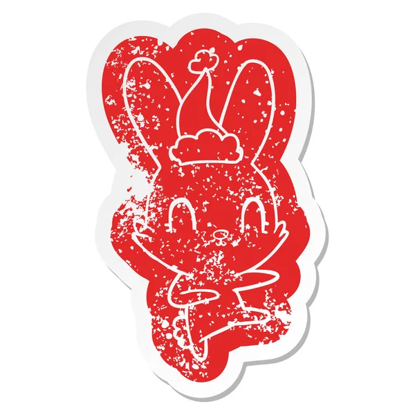 Lindo dibujo animado angustiado pegatina de un conejo bailando usando sant — Vector de stock