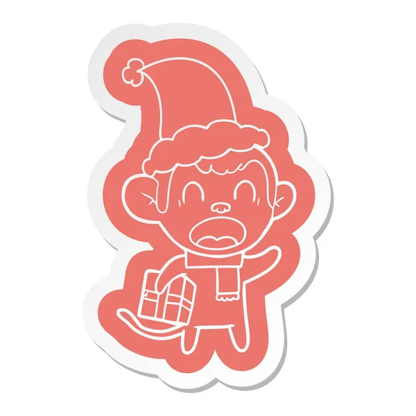 Shouting Quirky Cartoon Sticker Monkey Carrying Christmas Gift Wearing Santa — Stock Vector