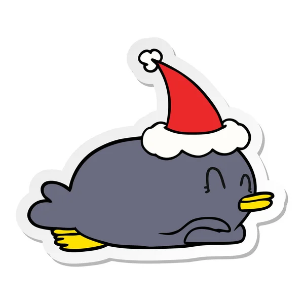 Пінгвін лежить на животі в капелюсі Санта — стоковий вектор