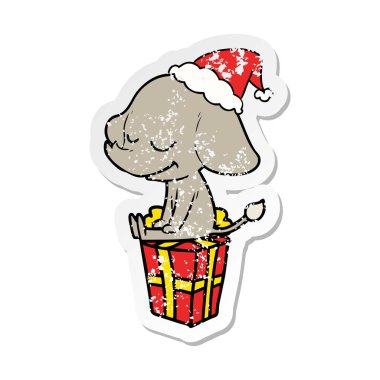 sıkıntılı etiket karikatür Noel Baba şapkası giyen gülümseyen bir filin el çekilmiş