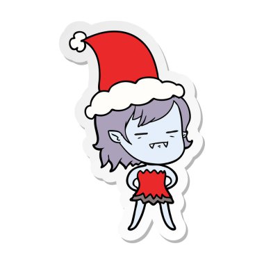 etiket karikatür Noel Baba şapkası giyen bir ölümsüz vampir kız el çekilmiş