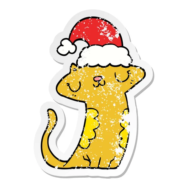 Aufkleber einer niedlichen Cartoon-Katze mit Weihnachtsmütze — Stockvektor