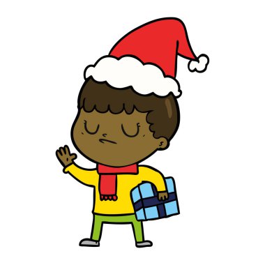 Noel Baba şapkası giyen bir huysuz çocuğun çizgi çizme