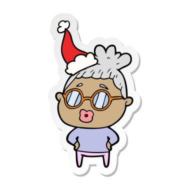 etiket karikatür Noel Baba şapkası giyen gözlük takan bir kütüphaneci kadının el çekilmiş